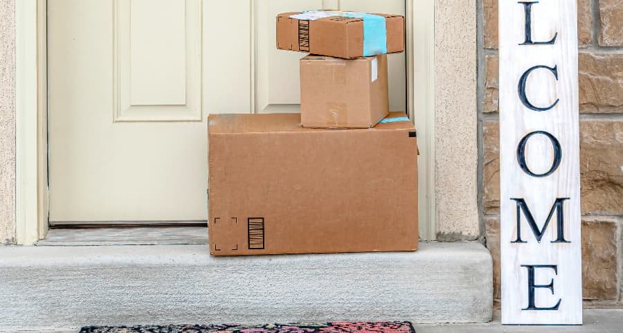 Deliveries on the front porch of a house with a welcome sign in Toledo